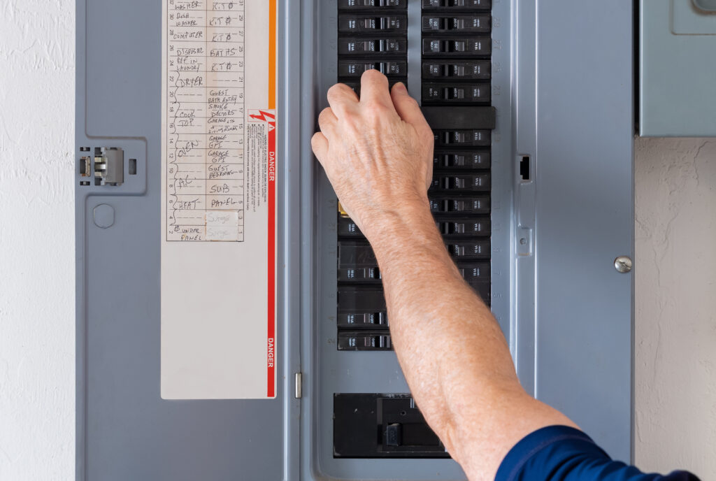 Resetting tripped breaker in residential electricity power panel